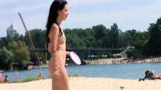 nudist teen enjoys a beautiful day at the beach