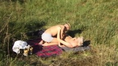 Insatiable blond player swallows his lover's dick while outdoors