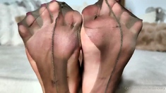 Brunette with foot fetish rubs big dick with her feet in POV
