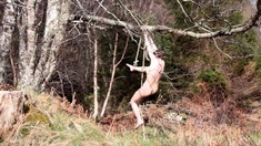 Naked self-bondage in the woods gone wrong.