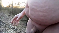 Chubby masturbates in the woods